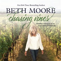 The author walking through a vineyard.