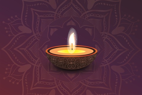 Diwali candal on a purple and red background.