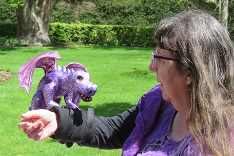 Arty Vicky and her purple dragon.