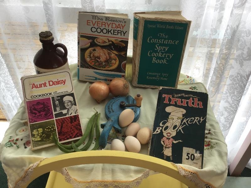 Assortment of vintage cookbooks.